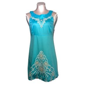 Lilly Pulitzer aqua dress with white stitching. Yellow underneath. Size 4